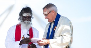 Rev Rronang Garrawurra and Rev Dr Andrew Dutney share communion at the Destiny Together vigil in Canberra.