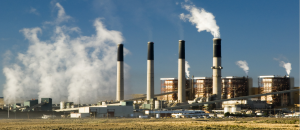 Coal-fired power plant with snoke. Photo by iStock