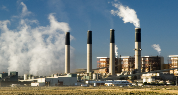 Coal-fired power plant with snoke. Photo by iStock