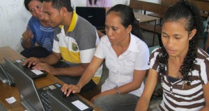 Teachers at Marcelo II School, Dili, using laptops donated to them by Glebe Road Uniting Church. Photo by Noela Rothery.