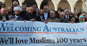 Leaders of many faiths gathered at Lakemba Mosque to express support for Australia's Muslims. Here they hold the 'We'll love Muslims 100 years' banner. This photo was supplied by the Uniting Church Assembly.