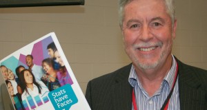 Bruce Mullan holds the newly-launched Stats have Faces resource at the 31st Synod.