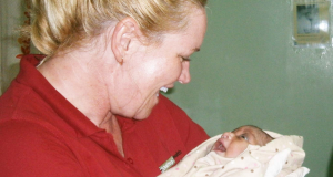 UnitingCare Health nurse, Trish Woods with the newborn baby. Photo was supplied.