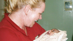 UnitingCare Health nurse, Trish Woods with the newborn baby. Photo was supplied.