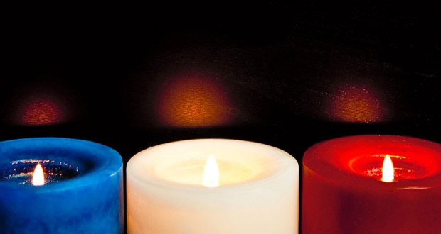 Three candles resembling the French tricolour