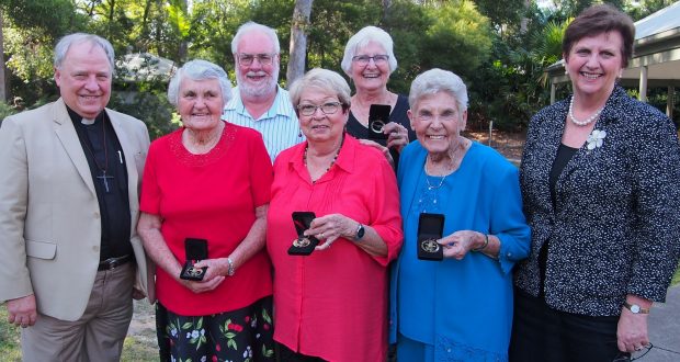 Five recipients of the 2016 Moderator's Community Service Medals with moderator Rev David Baker (far left) and UnitingCare Queensland CEO Anne Cross (far right). Photo by Holly Jewell.