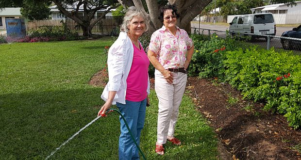 Cynthia Culleton (left), one of the creators of the Wulguru Uniting Church garden, with fellow cancer centre volunteer and congregation member Barbara Coates. Photo: Brian Venten