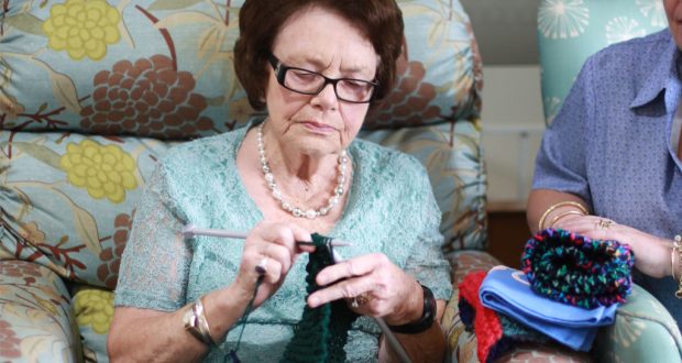 Dell, a resident at Wesley Mission Brisbane Jacobs Court Aged Care Community in Sinnamon Park, Brisbane, knitting for an aged-care facility in Shandong province, China. Photo was supplied.